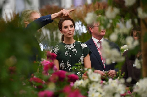 Catherine views a display of roses at the Chelsea Flower Show