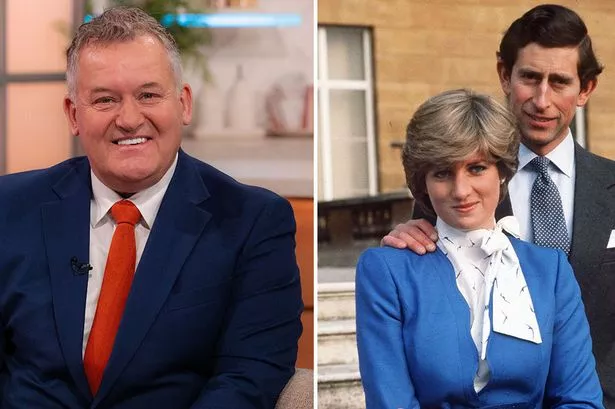 Paul Burrell next to a photo of Prince Charles and Princess Diana