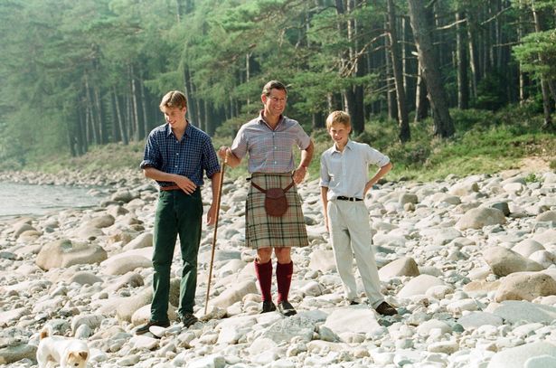 Charles, William and Harry joke around on the banks of the River Dee in Balmoral on August 12, 1997 - just days before their mother Diana was killed in a horror car crash