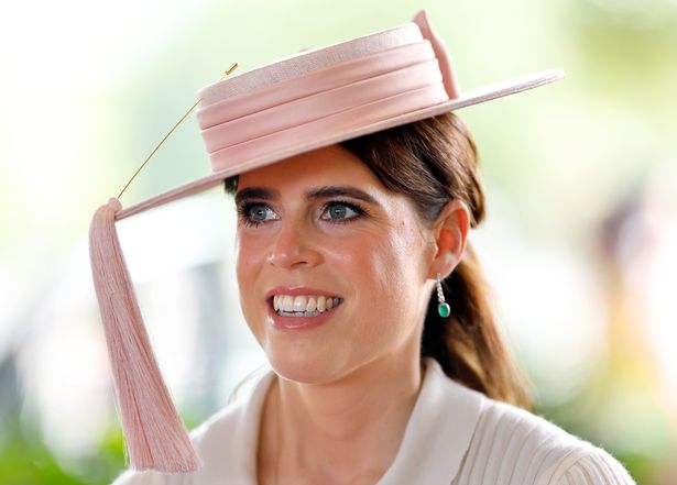 Princess Eugenie wearing pink and smiling