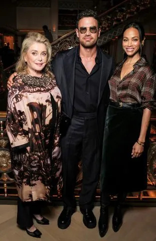 Darren Gerrish/Getty Catherine Deneuve, Theo James and Zoe Saldaña