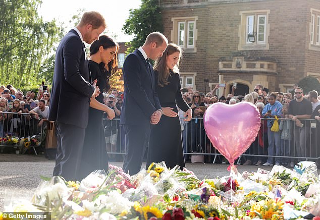 The Prince and Princess of Wales and the Duke and Duchess of Sussex inspect floral tribute outside WIndsor castle. Their appearance together  was a surprising show of unity