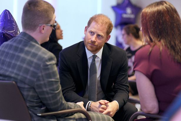 Britain's Prince Harry, Duke of Sussex (C) speaks with Declan Bitmead (L), recipient of the Inspirational Young Person 15-18 award, at the annual WellChild Awards in London on September 8, 2025.