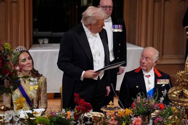 US President Donald Trump delivers a speech as Britain's King Charles III watches on during a State Banquet at Windsor Castle, in Windsor, on September 17, 2025, during the US President's second State Visit. US President Donald Trump arrived in Britain for an unprecedented second State Visit, with the UK government rolling out a royal red carpet welcome to win over the mercurial leader. (Photo by Yui Mok / POOL / AFP) (Photo by YUI MOK/POOL/AFP via Getty Images)