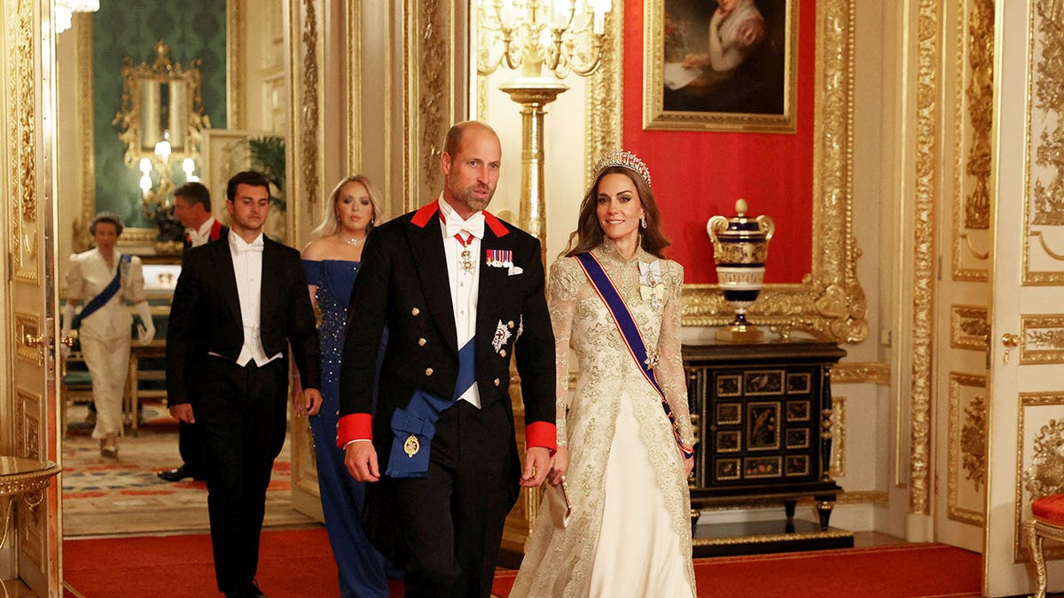 Kate Middleton walking alongside Prince William at the state banquet.