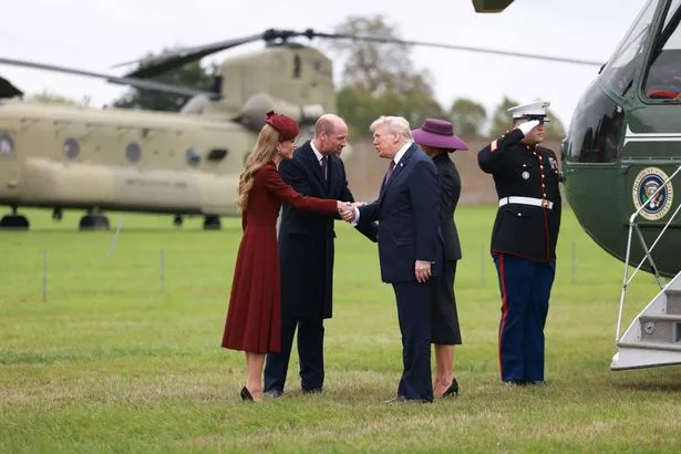 A woman shaking hands with an old man
