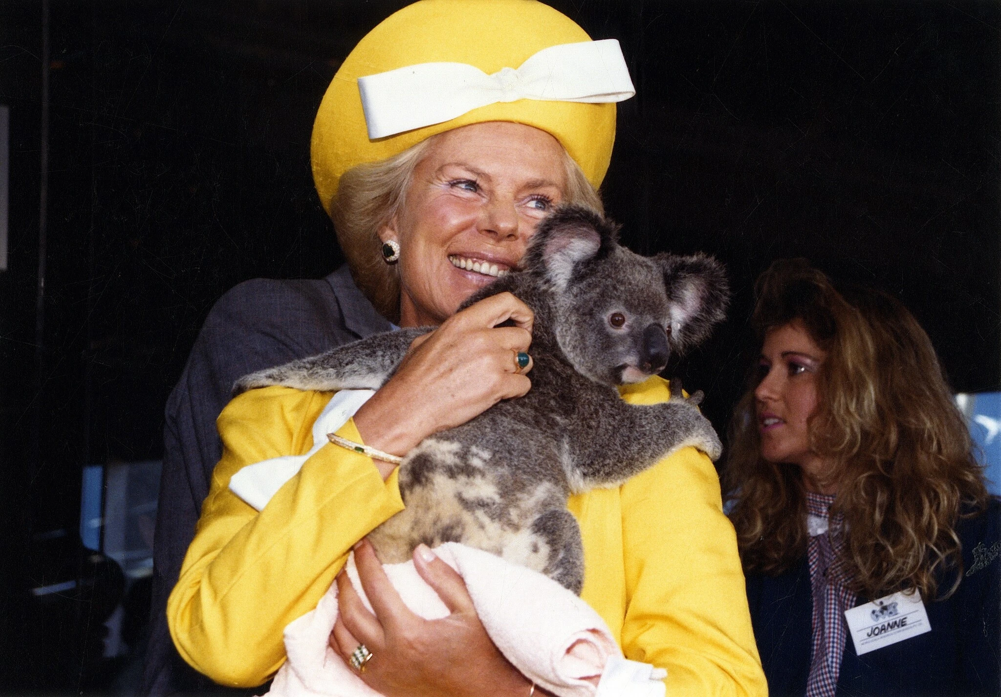 Her Royal Highness the Duchess of Kent holds a koala during a 1988 visit to Brisbane, Australia. Credit: Queensland State Archives, CC BY 3.0 AU, via Wikimedia Commons