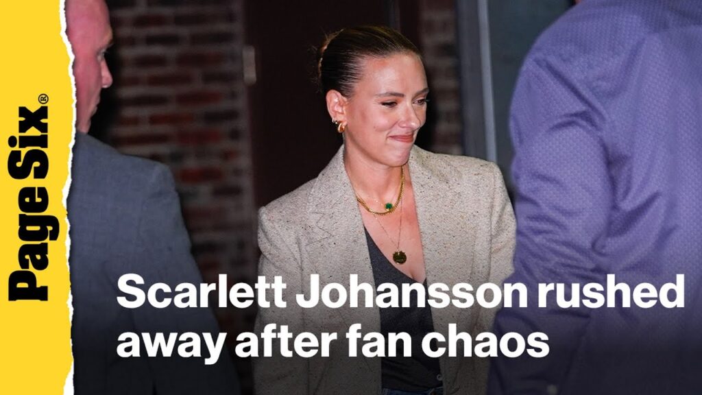 Scarlett Johansson rushed to SUV after fan barricade falls Scarlett Johansson rushed to SUV after fan barricade falls