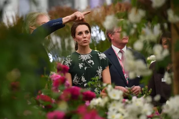 Catherine views a display of roses at the Chelsea Flower Show