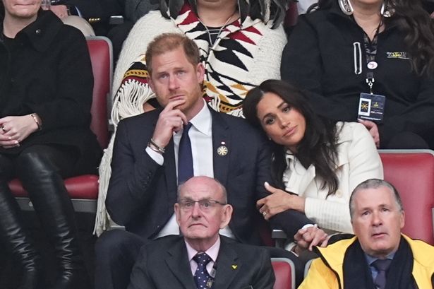 Meghan Markle resting her head on Prince Harry at the Invictus Games