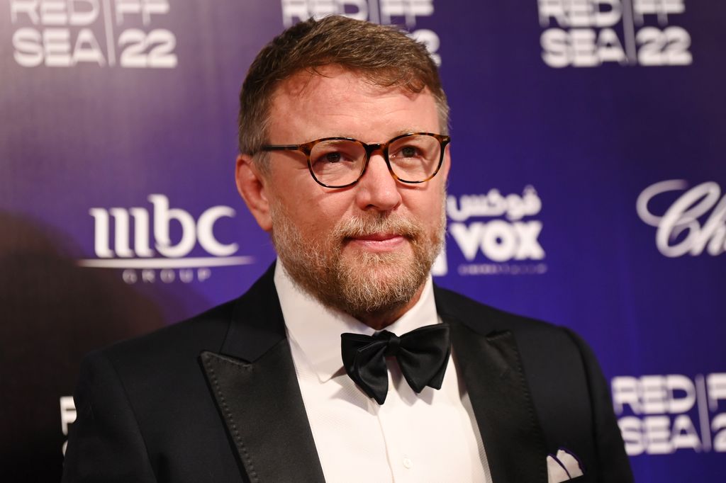 Guy Ritchie in a suit