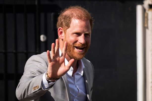 Harry waves to members of the public during his visit to the UK last week 