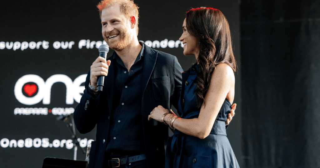 Video: Meghan Markle Looks 'Beyond Livid' at Prince Harry After Awkward Stage Gesture, Say Royal Fans
