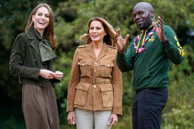 NATHAN HOWARD/POOL/AFP via Getty Kate Middleton, Melania Trump and Chief Scout Dwayne Fields on Sept. 18, 2025