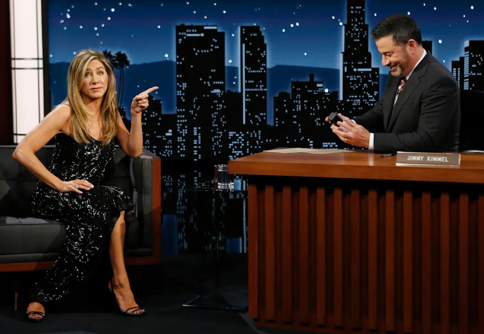 Jennifer Aniston and Jimmy Kimmel onstage.