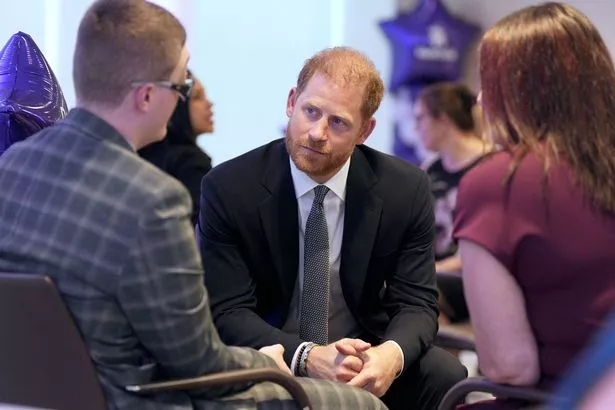 Britain's Prince Harry, Duke of Sussex (C) speaks with Declan Bitmead (L), recipient of the Inspirational Young Person 15-18 award, at the annual WellChild Awards in London on September 8, 2025.  