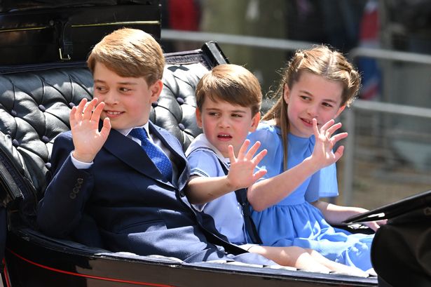 George, Louis, and Charlotte waving to crowds from a carriage