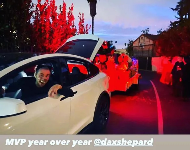 Kristen Bell/Instagram Dax Shepard poses for a photo while driving his neighborhood haunted hayride in November 2022.