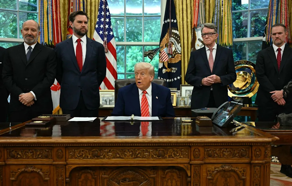 US President Donald Trump makes a trade announcement as US Secretary of Commerce Howard Lutnick (L), US Vice President JD Vance (2L), British ambassador to the United States Peter Mandelson (2R), and US Trade Representative Jamieson Greer (R) look on in the Oval Office of the White House in Washington, DC, on May 8, 2025. US President Donald Trump on announced a “full and comprehensive” trade agreement with Britain, which would be the first such deal since he launched his global tariffs blitz. (Photo by Jim WATSON / AFP) (Photo by JIM WATSON/AFP via Getty Images)
