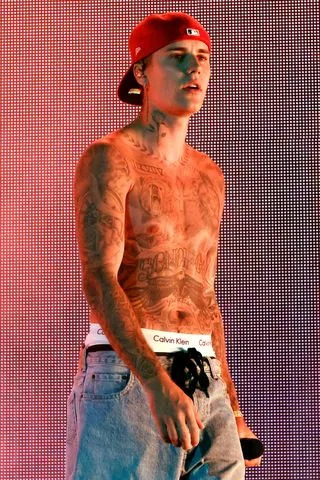 Kevin Winter/Getty Justin Bieber performs with Daniel Caesar on stage at Coachella 2022.