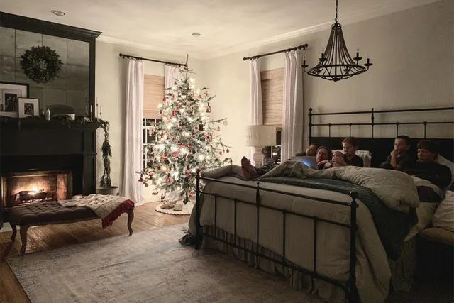 Joanna Gaines/Instagram Joanna Gaines and Chip Gaines cuddle in bed watching movies in December 2018.