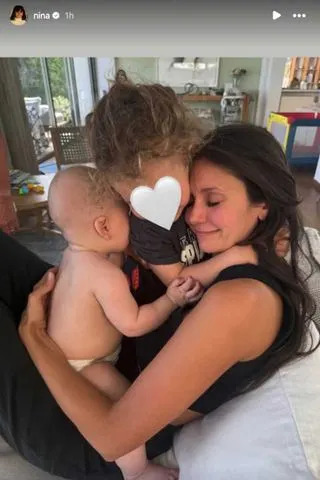 Nina Dobrev/Instagram Nina Dobrev is pictured posing with loved ones.