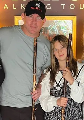 Witch City Walking Tours/Facebook Channing Tatum and Everly Tatum hold witch brooms in Salem, Mass., in August 2024.