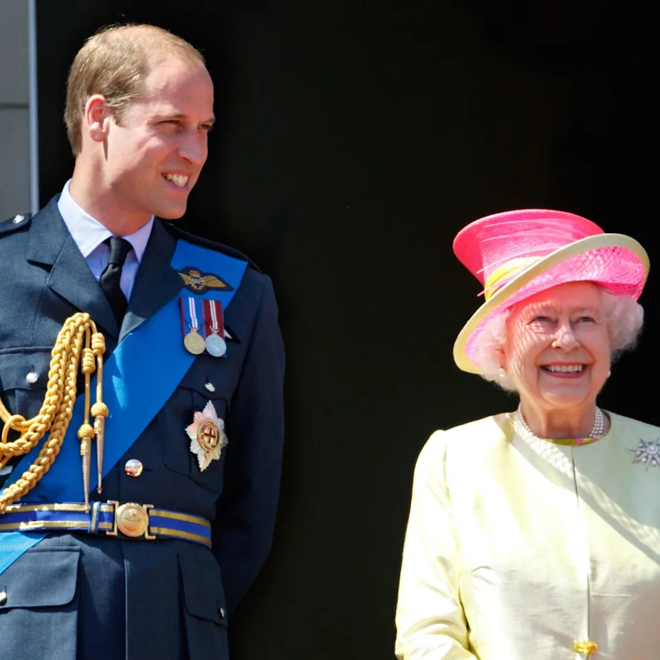  Prince William poses with Queen Elizabeth on Buckingham Palace balcony. 