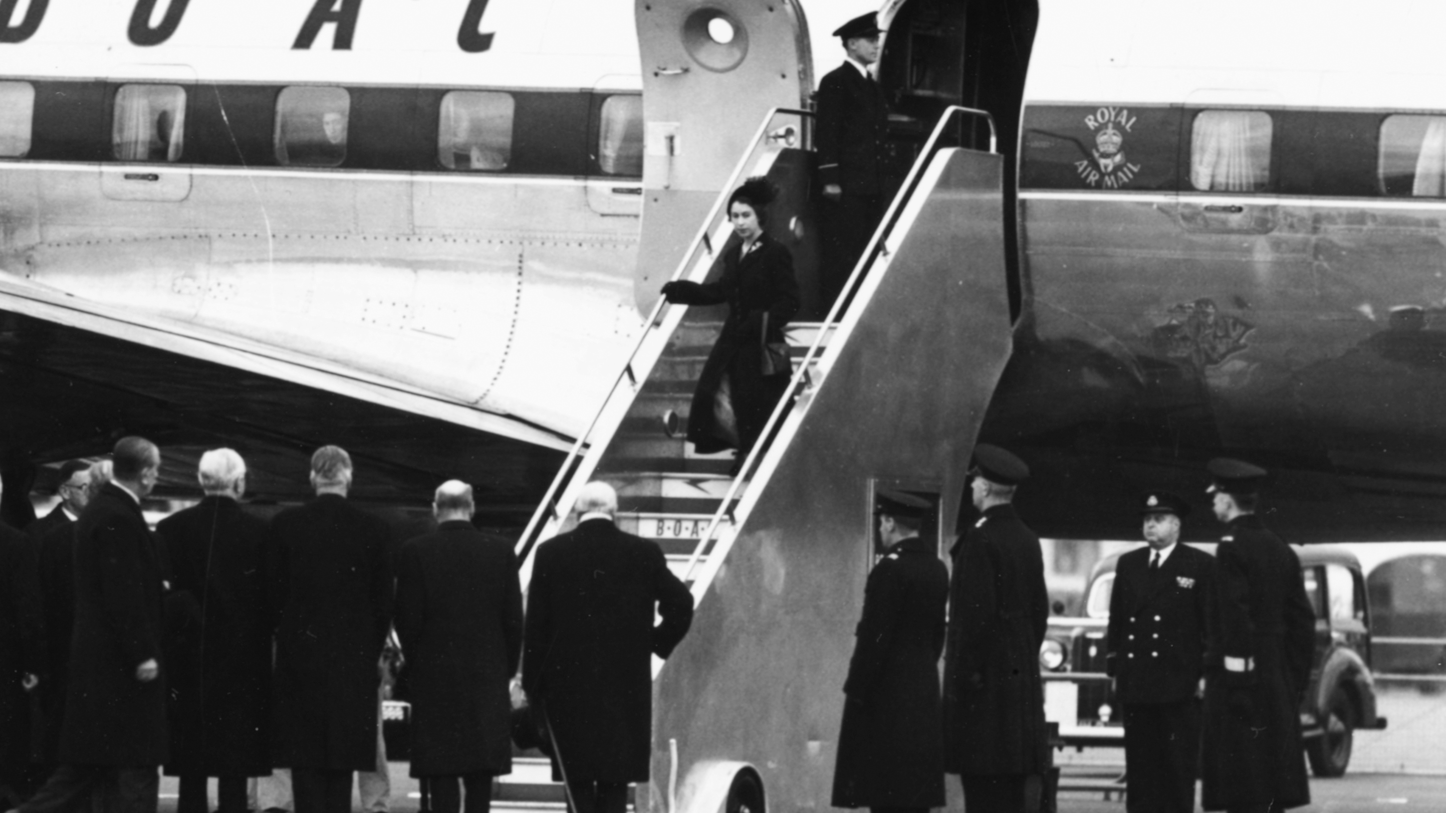 Queen Elizabeth II and Prince Philip, the Duke of Edinburgh, leaving their BOAC airliner as they return from Kenya following the death of King George VI and Elizabeth's accession to the throne, London, February 7th 1952