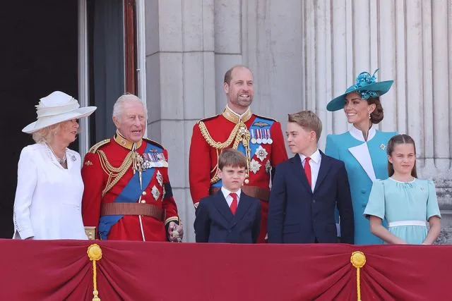 Neil Mockford/Getty  Queen Camilla, King Charles, Prince Louis, Prince George, Kate Middleton and Princess Charlotte at Trooping the Colour on June 14, 2025.