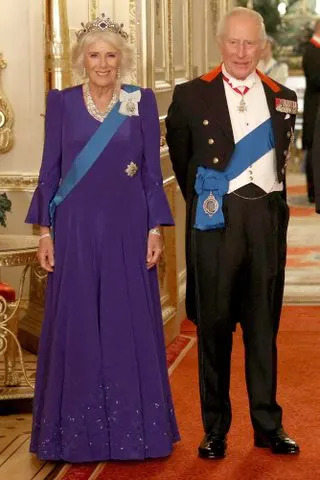 PHIL NOBLE/POOL/AFP via Getty Queen Camilla and King Charles at Windsor Castle on Sept. 17, 2025