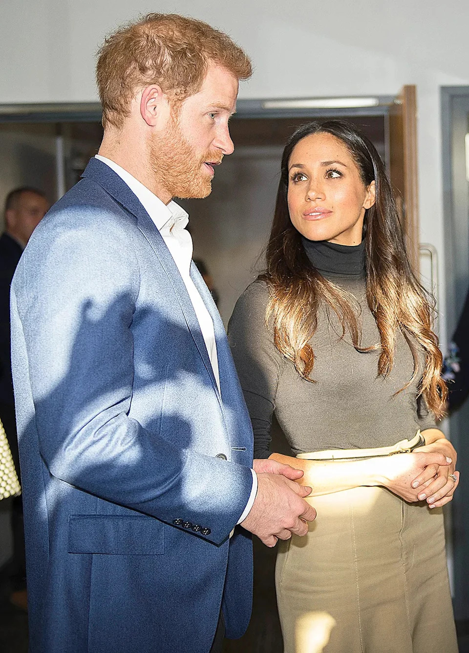 Meghan Markle looking up at Prince Harry.