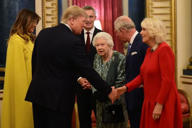 GEOFF PUGH/POOL/AFP via Getty Melania Trump and Donald Trump greet Queen Elizabeth, then-Prince Charles and the future Queen Camilla at Buckingham Palace on Dec. 3, 2019.