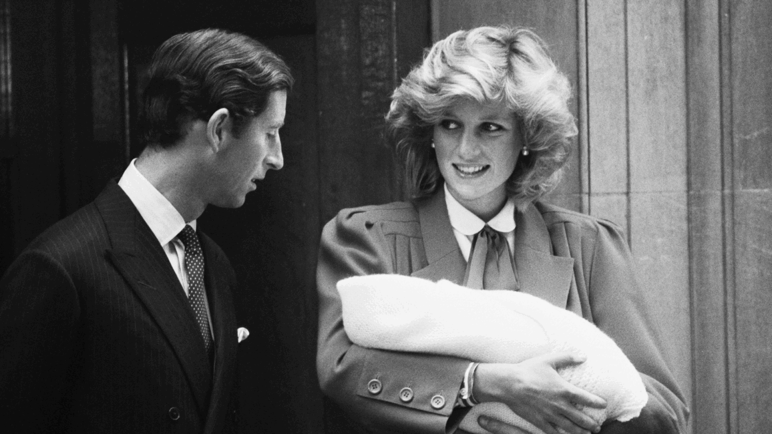 Princess Diana Admitted She Grew “Very Close” to King Charles Ahead of Prince Harry’s Birth Prince Harry and Princess Diana standing on hospital steps holding Prince Harry as a newborn
