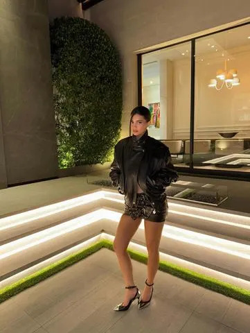 Instagram/Kylie Jenner Kylie Jenner with a skirt made out of belts
