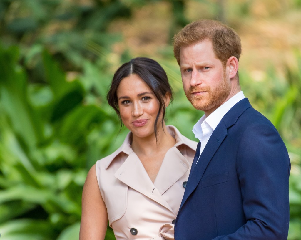 Prince Harry and Meghan Markle smiling