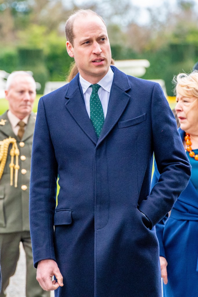 Prince William walking in long coat