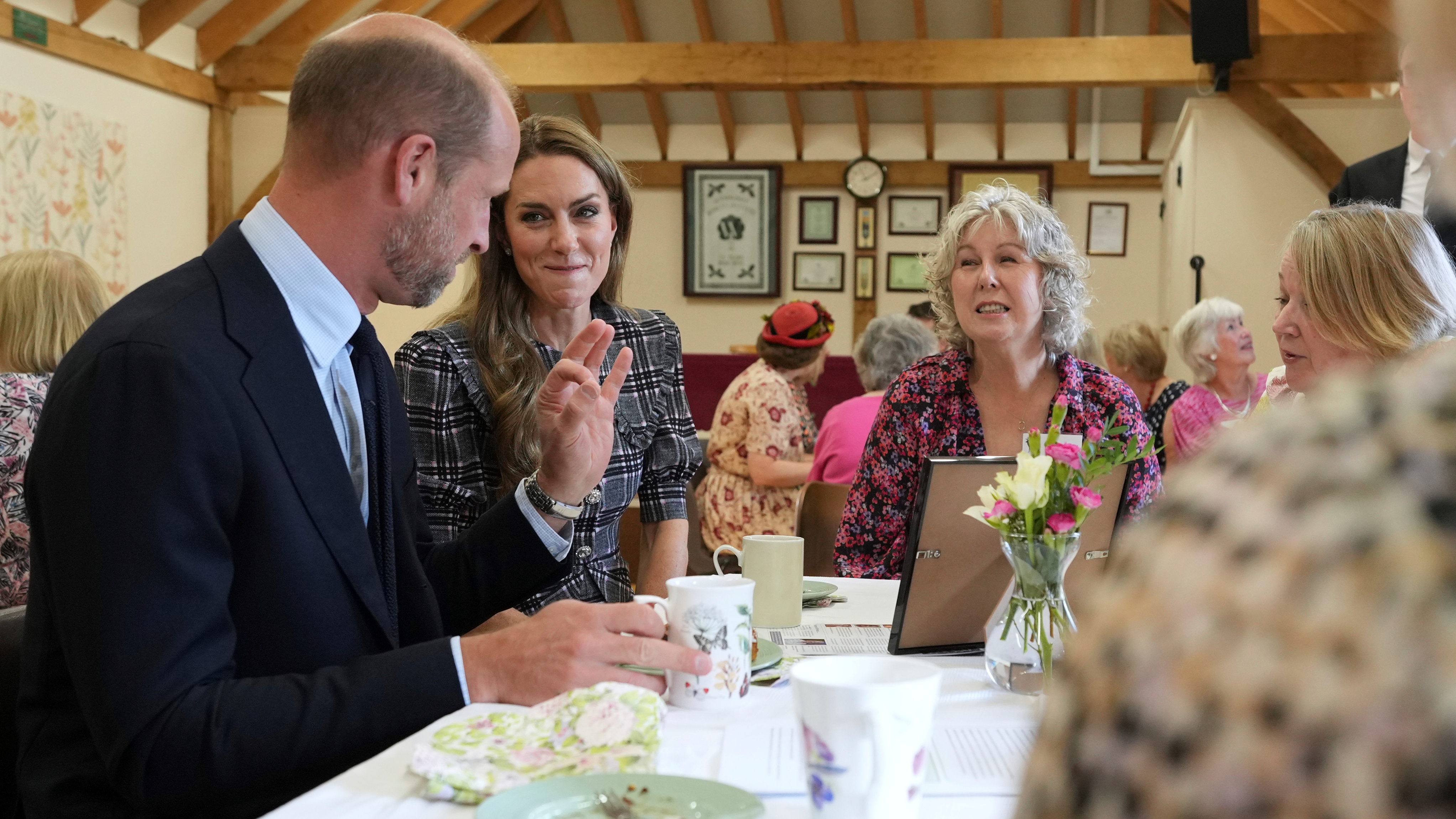 Catherine, Princess of Wales and Prince William, Prince of Wales speak to members as they visit the National Federation of Women's Institute (WI) to commemorate the three-year anniversary of the death of Queen Elizabeth II on September 8, 2025