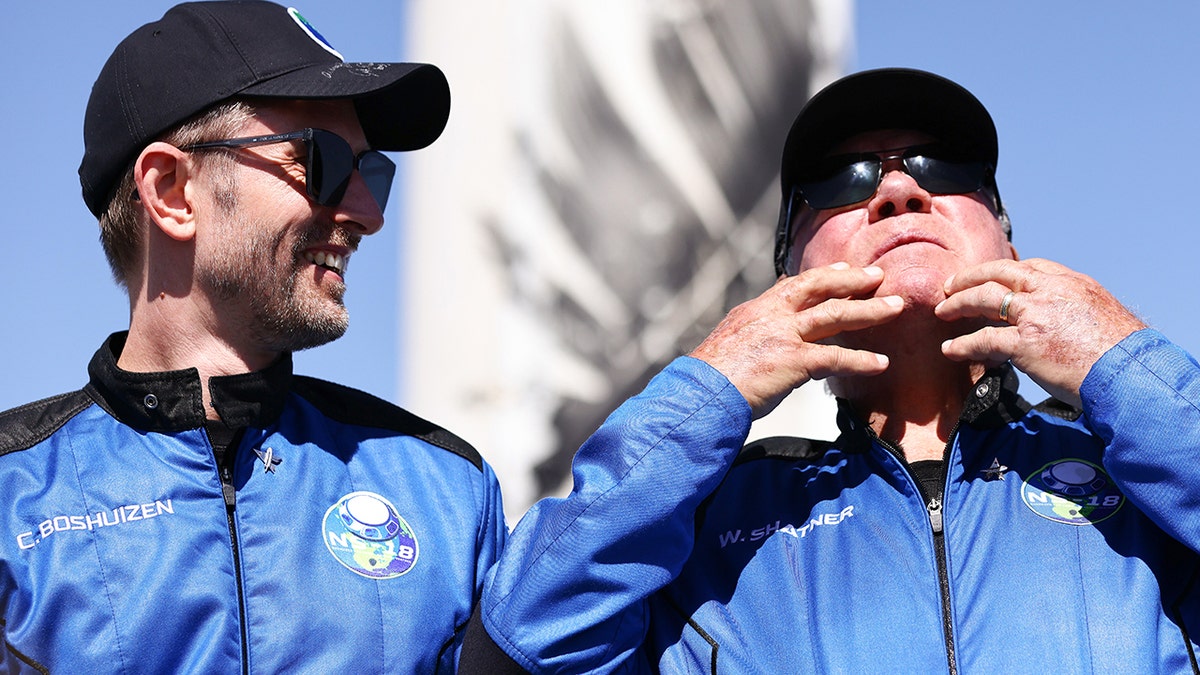 Star Trek actor William Shatner (R) gestures as Planet Labs co-founder Chris Boshuize