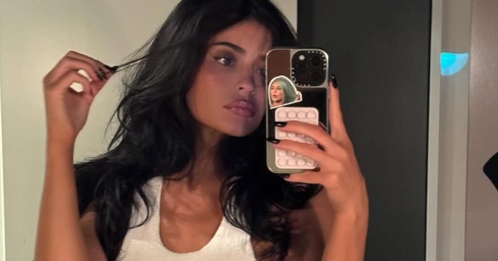 Kylie Jenner Showcases Her Tanned Abs in White Crop Top