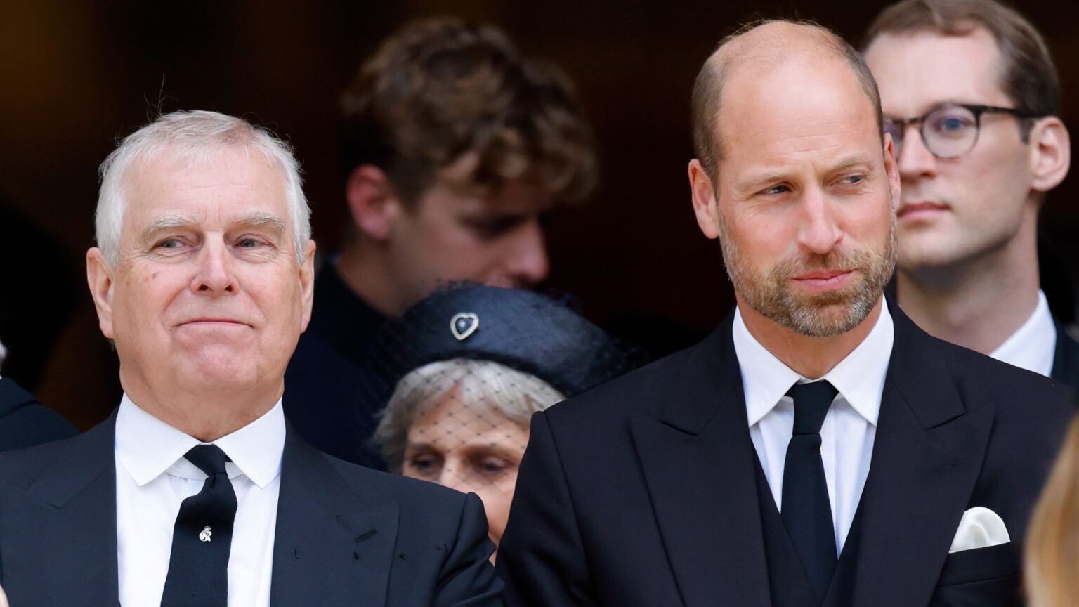 Source Says Prince William Warned Andrew in Awkward Moment Prince Andrew and Prince William both wear black suits to attend a funeral