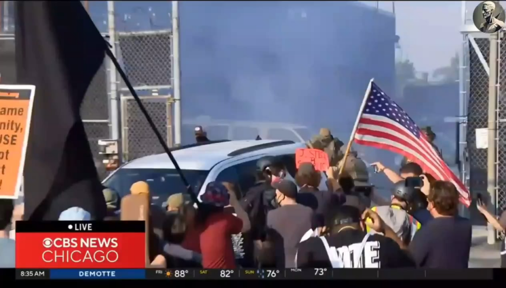 Federal agents release tear gas into a crowd of protesters outside an ICE processing facility in suburban Chicago