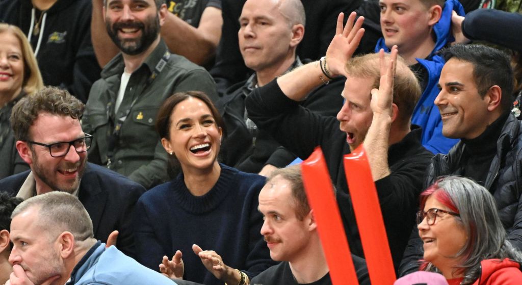JJ Chalmers, Meghan and Harry pulling a funny face 