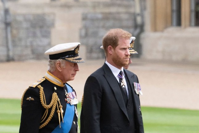 Britain's King Charles III (L) walks with his son Britain's Prince Harry, Duke of Sussex as they arrive at St George's Chapel inside Windsor Castle on September 19, 2022