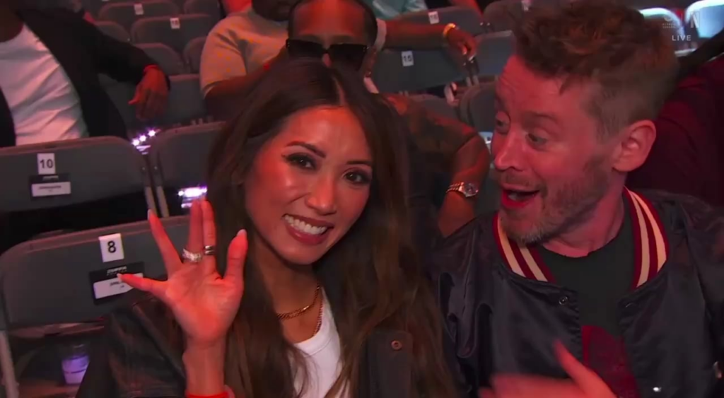Brenda Song and Macaulay Culkin being adorable at the Canelo vs Crawford fight