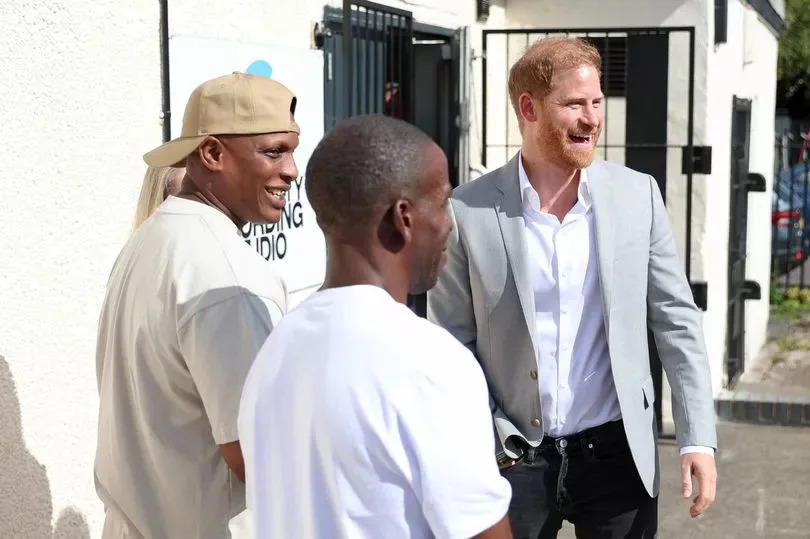 Harry greets the staff