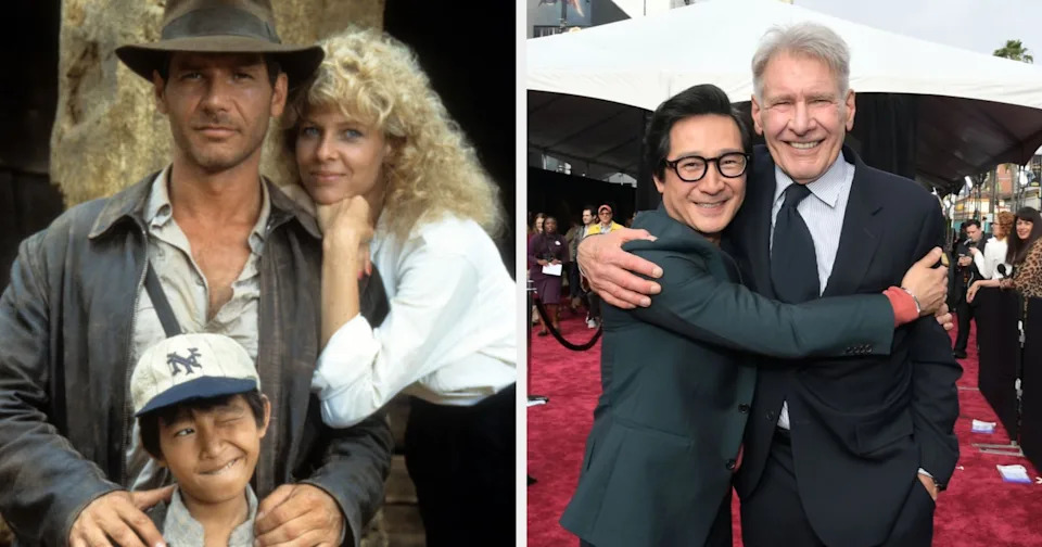 On left, three characters stand closely; on right, two actors hug under a tent on a red carpet