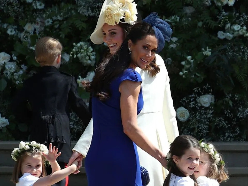  Britain’s Catherine, Duchess of Cambridge (in white), and Jessica Mulroney hold bridesmaids’ hands as they arrive for the wedding ceremony of Prince Harry, Duke of Sussex, and Meghan Markle at St George’s Chapel, Windsor Castle, on May 19, 2018.