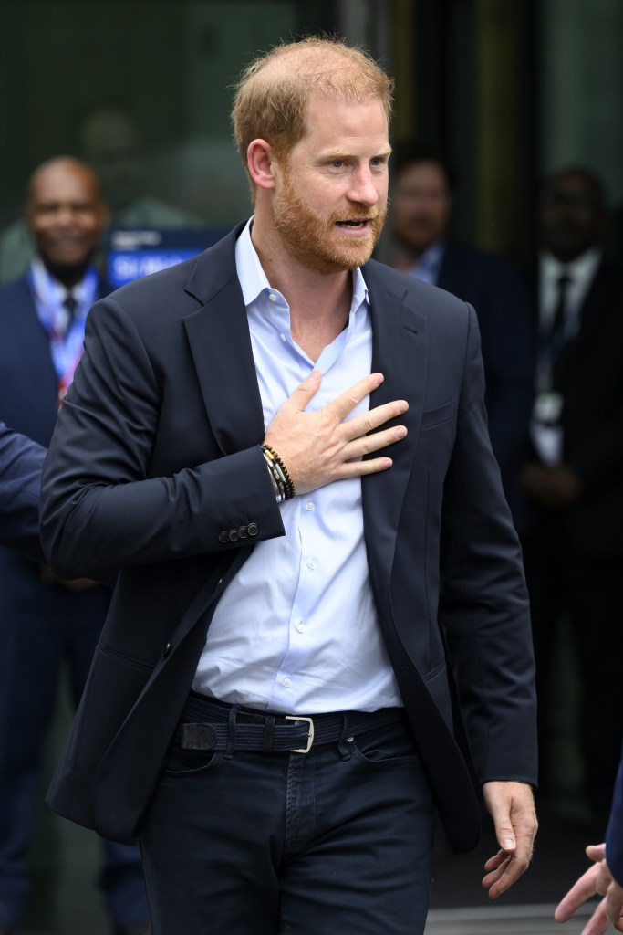 Prince Harry with his hand on his heart in UK