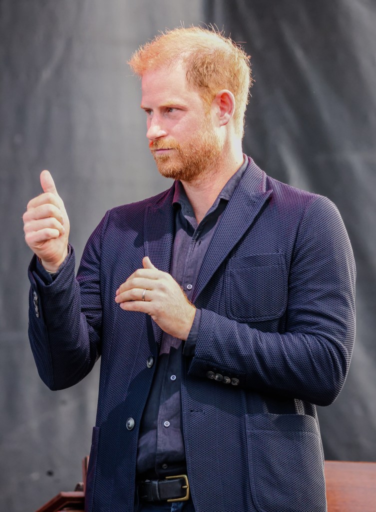 Prince Harry putting a thumbs up